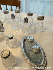 MaxSold Auction: Glass Salt & Pepper Shaker Assortment with Silver-Tone Napkin Holder - London (Ontario, Canada) PARTNER MANAGED Downsizing Online Auction - Reeves Avenue