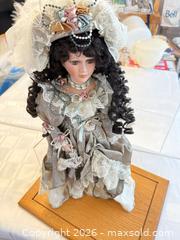 MaxSold Auction: Victorian-Style Porcelain Doll with Wooden Display Stand - London (Ontario, Canada) PARTNER MANAGED Downsizing Online Auction - Reeves Avenue