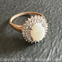 MaxSold Auction: 10K Gold Ring With Center Oval White Stone and Diamond-Like Accents - Hamilton (Ontario, Canada) SELLER MANAGED Downsizing Online Auction -  Sherman Avenue South