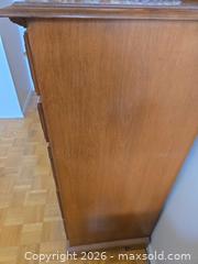 MaxSold Auction: 5-Drawer Medium Brown Oak Tone Dresser with Metal Handles - Calgary (Alberta, Canada) PARTNER MANAGED Downsizing Online Auction - Cedar Crescent Southwest (CONDO)