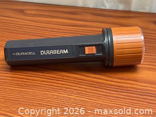 MaxSold Auction: Vintage Black and Orange Duracell Durabeam Flashlight (shipping available) - Campbell (California, USA) SELLER MANAGED Downsizing Online Auction - Dell Avenue 