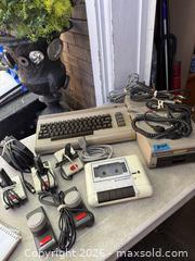 MaxSold Auction: A BIG LOT OF COMMODORE 64 ITEMS. KEYBOARD, DISC DRIVE + MUCH MORE. - Hamilton (Ontario, Canada) SELLER MANAGED Downsizing Online Auction - St. Clair Avenue