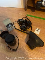 MaxSold Auction: Konica Autoreflex T Camera with Hexanon Lens, Tamron Lens and Accessories - Addington Highlands (Ontario, Canada) PARTNER MANAGED Downsizing Online Auction - Highway 41