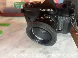 MaxSold Auction: Konica Autoreflex T Camera with Hexanon Lens, Tamron Lens and Accessories - Addington Highlands (Ontario, Canada) PARTNER MANAGED Downsizing Online Auction - Highway 41