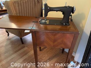 MaxSold Auction: Seamstress Rotary Sewing Machine in Wooden Cabinet with Fold-Out Table - Addington Highlands (Ontario, Canada) PARTNER MANAGED Downsizing Online Auction - Highway 41
