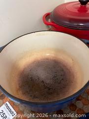MaxSold Auction: Two Enameled Cast Iron Dutch Ovens Blue and Red with Pyrex Booklet - Addington Highlands (Ontario, Canada) PARTNER MANAGED Downsizing Online Auction - Highway 41