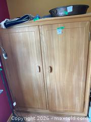MaxSold Auction: Wooden Storage Cabinet with Double Doors - Addington Highlands (Ontario, Canada) PARTNER MANAGED Downsizing Online Auction - Highway 41