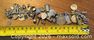 MaxSold Auction: Sterling Silver 7in Charm Bracelet with Travel & Religious Charms - Ottawa (Ontario, Canada) PARTNER MANAGED Downsizing Online Auction - Fallowfield Road