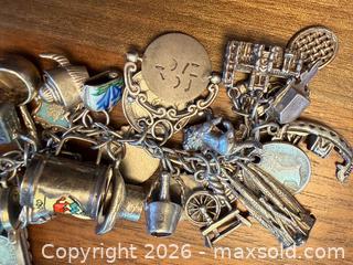 MaxSold Auction: Sterling Silver 7in Charm Bracelet with Travel & Religious Charms - Ottawa (Ontario, Canada) PARTNER MANAGED Downsizing Online Auction - Fallowfield Road