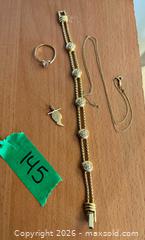 MaxSold Auction: 10K Yellow Gold Bracelet, Necklace, Pendant & Pink Stone Ring - Kingston (Ontario, Canada) SELLER MANAGED Downsizing Online Auction -  Roosevelt Drive
