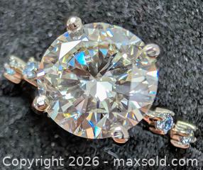 MaxSold Auction: 10k(2.3g), lab diamond (3ct), lab diamond (0.06ct)ring, size 6.5 - Toronto (Ontario, Canada) PARTNER MANAGED Downsizing Online Auction - Yonge Street
