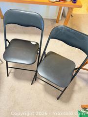 MaxSold Auction: Black Metal Folding Chairs with Padded Vinyl Seats (Set of 2) stuck paper on seat and hole - Vancouver (British Columbia, Canada) SELLER MANAGED Estate Sale Online Auction - West King Edward Avenue (CONDO)
