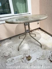 MaxSold Auction: Round Glass Top Patio Table, Metal Frame, 34" Dia - Vancouver (British Columbia, Canada) SELLER MANAGED Estate Sale Online Auction - West King Edward Avenue (CONDO)