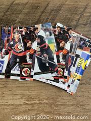 MaxSold Auction: 7 Ottawa Senators Cards - Ottawa (Ontario, Canada) SELLER MANAGED Reseller Online Auction - Canadian Shield Avenue (CONDO)