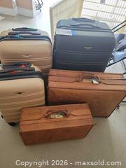 MaxSold Auction: Rolling Hardshell Spinner Suitcase & Leather Briefcase Set - Winter Haven (Florida, USA) PARTNER MANAGED Estate Sale Online Auction - Jardin Lane
