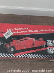 MaxSold Auction: NEW Big Red Jacks 3-Tone SUV Trolley Jack - Cobourg (Ontario, Canada) SELLER MANAGED Downsizing Online Auction - Division Street