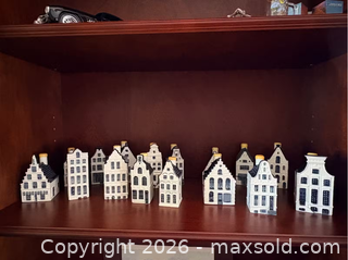 MaxSold Auction: Collectible set of KLM Delft Blue canal house miniature bottles, modeled after historic Dutch canal houses.  - Vancouver (British Columbia, Canada) SELLER MANAGED Moving Online Auction - West 11th Avenue