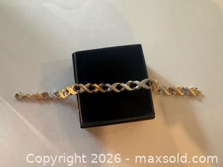 MaxSold Auction: Lightweight 14K White and Yellow Gold Bracelet with lots of kisses (xxx)!  - North Dundas (Ontario, Canada) SELLER MANAGED Downsizing Online Auction - Moffat