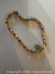 MaxSold Auction: Lightweight 14K White and Yellow Gold Bracelet with lots of kisses (xxx)!  - North Dundas (Ontario, Canada) SELLER MANAGED Downsizing Online Auction - Moffat