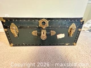 MaxSold Auction: Medium Black Steamer Trunk with Brass Hardware - Knightdale (North Carolina, USA) PARTNER MANAGED Downsizing Online Auction - Sycamore Street