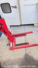 MaxSold Auction: Red 1100 lb Motorcycle Lift/Hoist with Hand Pump & Wheels - Mapleton (Ontario, Canada) PARTNER MANAGED Downsizing Online Auction - Wellington County Road 109