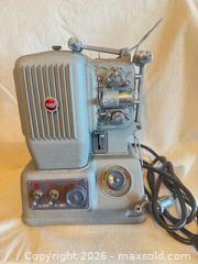 MaxSold Auction: Elmo E-80 8mm / Super 8 Film Projector, Silver/Gray - Toronto (Ontario, Canada) SELLER MANAGED Downsizing Online Auction -  Weston Road (CONDO)