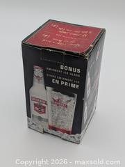 MaxSold Auction: Smirnoff Ice Branded Drinking Glass with Orange Bottom - Cobourg (Ontario, Canada) SELLER MANAGED Downsizing Online Auction - Division Street