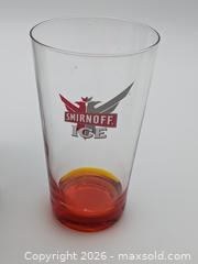 MaxSold Auction: Smirnoff Ice Branded Drinking Glass with Orange Bottom - Cobourg (Ontario, Canada) SELLER MANAGED Downsizing Online Auction - Division Street