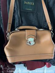 MaxSold Auction: Danier Leather Jackets, Vest, Crossbody Bags, and Handbag Assortment - Kingston (Ontario, Canada) PARTNER MANAGED Downsizing Online Auction - Kingsdale Avenue