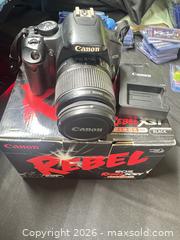 MaxSold Auction: Canon EOS Rebel XSi (450D) with EF-S 18-55mm Kit Lens 32Gb SD Card Camera Bag (Working) - Buena Park (California, USA) SELLER MANAGED Moving Online Auction - Melrose Street