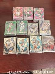 MaxSold Auction: Panini Mosaic Football Cards — Parallels, Prizms & Rookies over 330+ cards all sleeved  - Buena Park (California, USA) SELLER MANAGED Moving Online Auction - Melrose Street