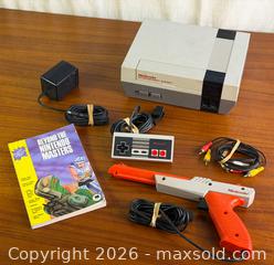 MaxSold Auction: Nintendo NES Console Bundle w/ Zapper Light Gun, Controller, Cables & Beyond Nintendo Masters Guide - Hamilton (Ontario, Canada) SELLER MANAGED Estate Sale Online Auction - Gertrude Street