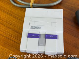 MaxSold Auction: Nintendo SNES Classic Edition Mini Console Bundle w/ 2 Controllers, HDMI, Wii Remote & Power Adapter - Hamilton (Ontario, Canada) SELLER MANAGED Estate Sale Online Auction - Gertrude Street
