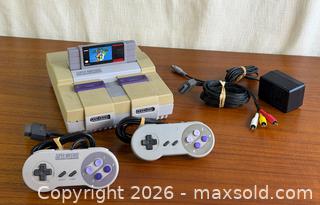 MaxSold Auction: Nintendo Super Nintendo SNES Console Bundle w/ Super Mario World 2 Controllers Untested - Hamilton (Ontario, Canada) SELLER MANAGED Estate Sale Online Auction - Gertrude Street