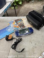 MaxSold Auction: A SONY PSP + CASE + GAME BOOKLETS. WORKING. - Hamilton (Ontario, Canada) SELLER MANAGED Estate Sale Online Auction - St. Clair Avenue