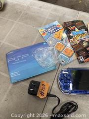 MaxSold Auction: A SONY PSP + CASE + GAME BOOKLETS. WORKING. - Hamilton (Ontario, Canada) SELLER MANAGED Estate Sale Online Auction - St. Clair Avenue
