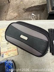 MaxSold Auction: A SONY PSP + CASE + GAME BOOKLETS. WORKING. - Hamilton (Ontario, Canada) SELLER MANAGED Estate Sale Online Auction - St. Clair Avenue