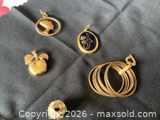 MaxSold Auction: 10K Gold Pendants, Charms & Multi-Loop Bangles - Toronto (Ontario, Canada) PARTNER MANAGED Downsizing Online Auction - Norris Place