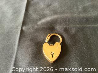 MaxSold Auction: 10K Yellow Gold Padlock Pendant - Toronto (Ontario, Canada) PARTNER MANAGED Downsizing Online Auction - Norris Place