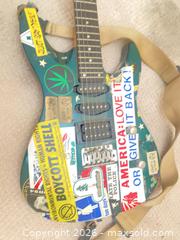 MaxSold Auction: Green 6-String Electric Guitar H-S-S with Strap - Vancouver (British Columbia, Canada) SELLER MANAGED Moving Online Auction - 6th Avenue East (CONDO)