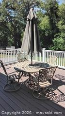 MaxSold Auction: Cast Aluminum Patio Set with Swivel Chairs, Umbrella & Swing - Framingham (Massachusetts, USA) PARTNER MANAGED Downsizing Online Auction - Lanewood Avenue