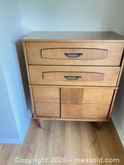 MaxSold Auction: Mid-Century Modern Wood Veneer Tall Chest, Dresser & Mirror Set - Ottawa (Ontario, Canada) SELLER MANAGED Moving Online Auction - Plante Drive