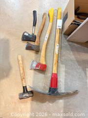 MaxSold Auction:  Hand Tools: Axes, Pickaxe, Sledge, Wood Handles A - Portland (Ontario, Canada) Moving Online Auction - R29 Road 