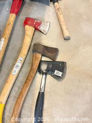 MaxSold Auction:  Hand Tools: Axes, Pickaxe, Sledge, Wood Handles A - Portland (Ontario, Canada) Moving Online Auction - R29 Road 