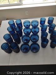 MaxSold Auction: Blue Pressed Ribbed Glass 24-Piece Set - Arvada (Colorado, USA) SELLER MANAGED Moving Online Auction - W 54th Lane