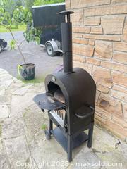 MaxSold Auction: Black Wood-Fired Portable Outdoor Pizza Oven on Cart - Leeds And The Thousand Islands (Ontario, Canada) SELLER MANAGED Moving Online Auction - Chisamore Point Road