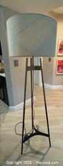 MaxSold Auction: Brace Ombre floor lamp from CB2 features a brass-finished tripod stand that transitions in black, 64.5" H - Miami (Florida, USA) PARTNER MANAGED Downsizing Online Auction - North West 5th Street (STORAGE)