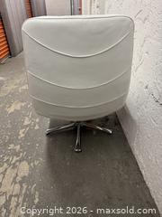 MaxSold Auction: White Leather Lounge Chair with Ottoman, Chrome Base - Miami (Florida, USA) PARTNER MANAGED Downsizing Online Auction - North West 5th Street (STORAGE)