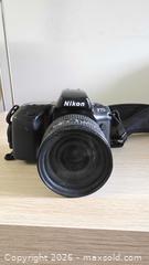 MaxSold Auction: Nikon F70 35mm SLR Camera + AF Nikkor 24-120mm f/3.5-5.6 Lens - Mississauga (Ontario, Canada) SELLER MANAGED Downsizing Online Auction - Wild Rose Street