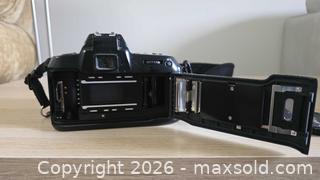 MaxSold Auction: Nikon F70 35mm SLR Camera + AF Nikkor 24-120mm f/3.5-5.6 Lens - Mississauga (Ontario, Canada) SELLER MANAGED Downsizing Online Auction - Wild Rose Street